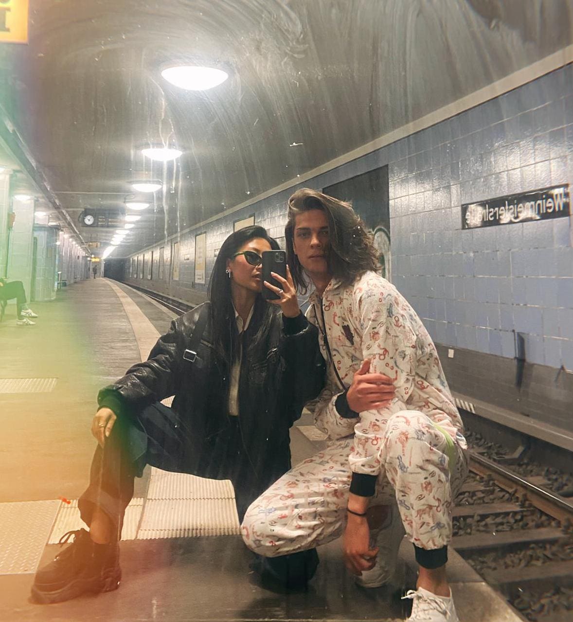 two hipsters posing in metro